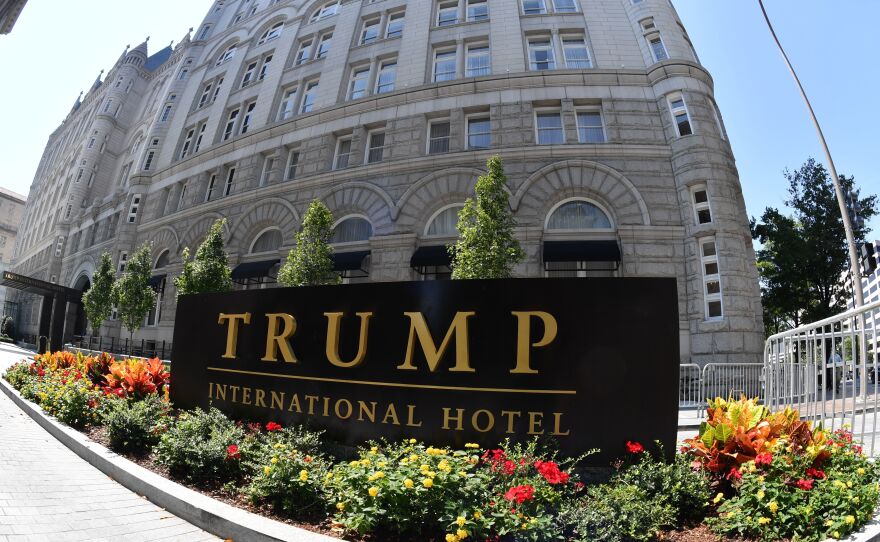 A lawsuit against President Trump alleges he is violating the Foreign and Domestic Emoluments clauses of the Constitution. Plaintiffs' lawyer Deepak Gupta says Trump's Washington hotel (above) is "an emoluments magnet."