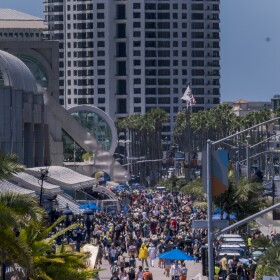 Crowds walk outside the San Diego Convention Center during Comic-Con on July 25, 2025. 