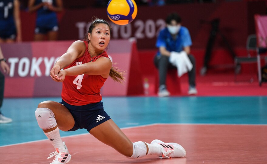 Team USA's Justine Wong-Orantes hits the ball in a match against Serbia during the Tokyo Olympics on Aug. 6, 2021. She won a gold medal with her teammates. Because the U.S. doesn't have a pro league, she's currently playing in Germany.