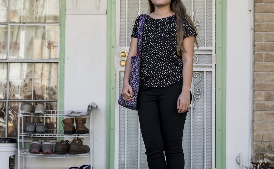 My Linh Tran, 22, a 4th grade school teacher, in front of her family's apartment at the Thai Xuan Village apartment complex in Houston