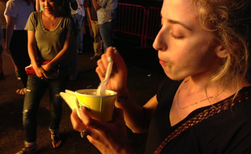 Eva uses all of her strength to get the Concrete out of the cup.