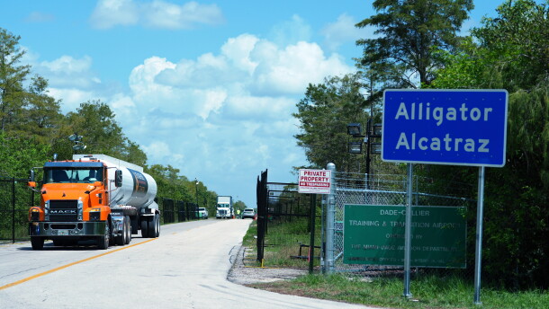 FILE - Trucks come and go from the "Alligator Alcatraz" immigration detention center in the Florida Everglades, Aug. 28, 2025, in Collier County, Fla.