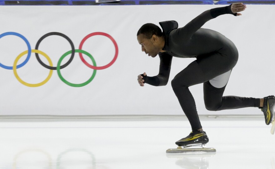 Shani Davis of the U.S. skates in the prototype of the official US Speedskating suit during a training session at the Adler Arena Skating Center in Sochi, Russia, Friday. As U.S. skates have fallen short of their goals at the Winter Olympics, some skaters have asked to switch to their old suits.