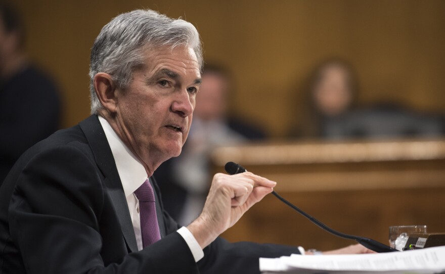 Federal Reserve Chairman Jerome Powell testifies before the Senate Banking Committee on Feb. 26. "It may be some time before the outlook for jobs and inflation calls clearly for a change in policy," he said Wednesday.