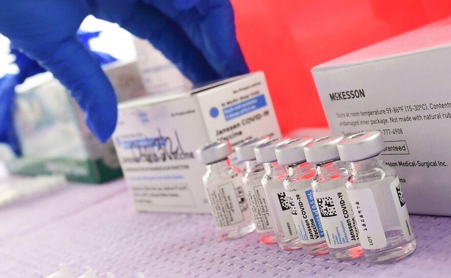 Bottles of the single-dose Johnson & Johnson Janssen COVID-19 vaccine await transfer into syringes for administering in March in Los Angeles. The CDC had called on Tuesday for a pause in administering the vaccine.