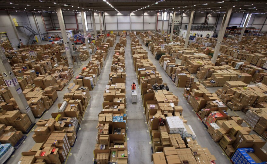 Workers process orders at an Amazon.com fulfillment center in Swansea, Wales, as they prepare for their busiest time of the year.