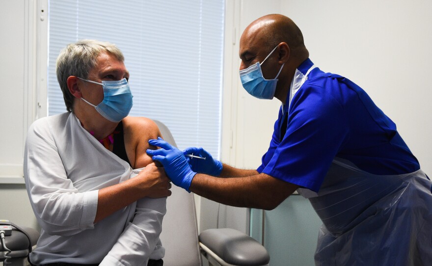 Nurse Vash Deelchand inoculated Kate Bingham, chair of the U.K. government's vaccine task force, with a Novavax vaccine at the Royal Free Hospital in London in October.