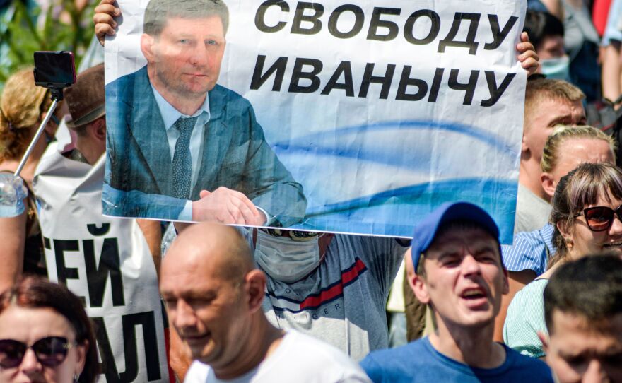 People carry a banner demanding freedom for Furgal during a demonstration in Khabarovsk on July 18.