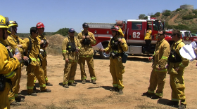 Firefighters meet up after completing a brush clearing training in San Diego's East County on May 22, 2013. 
