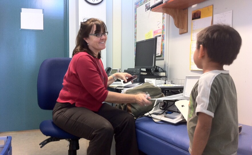 Corinne McCarthy, a San Diego Unified nursing coordinator for schools from Linda Vista to Tierrasanta, prepares to give a Carson Elementary student a hearing screening, Oct. 25, 2012.