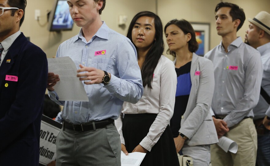 Allyson Chiu, 17, center, who will be a senior at Cupertino High, waits with others to call on members of the State Board of Education to adopt proposed changes in classroom instruction to include prominent gay people and LGBT rights milestones in history classes in Sacramento, July 14, 2016,