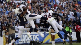Denver Broncos free safety Darian Stewart (26) breaks up an end-zone pass intended for San Diego Chargers wide receiver Malcom Floyd (80) as cornerback Aqib Talib, center, defends during the second half of an NFL football game in San Diego, Dec. 6, 2015.