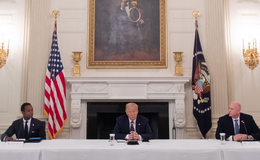 President Trump hosts a roundtable discussion Monday on police and community relations with law enforcement officials in the State Dining Room at the White House.