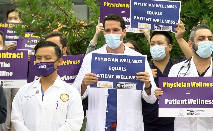 UC San Diego Health resident physicians protest working conditions outside of UCSD’s Jacobs Medical Center.
