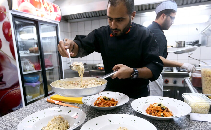 Libyan chefs whip up meals at Toucan, a newly opened Mediterranean restaurant in Tripoli.