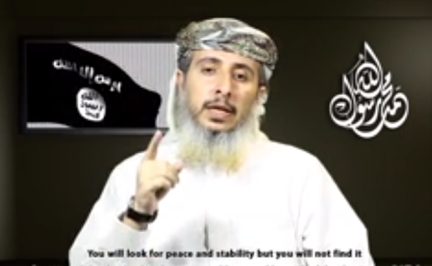 A screenshot of a video released by Al-Qaida in the Arabian Peninsula, showing a commander,  Nasr al-Ansi, taking responsibility for the attack on a satirical magazine in Paris.