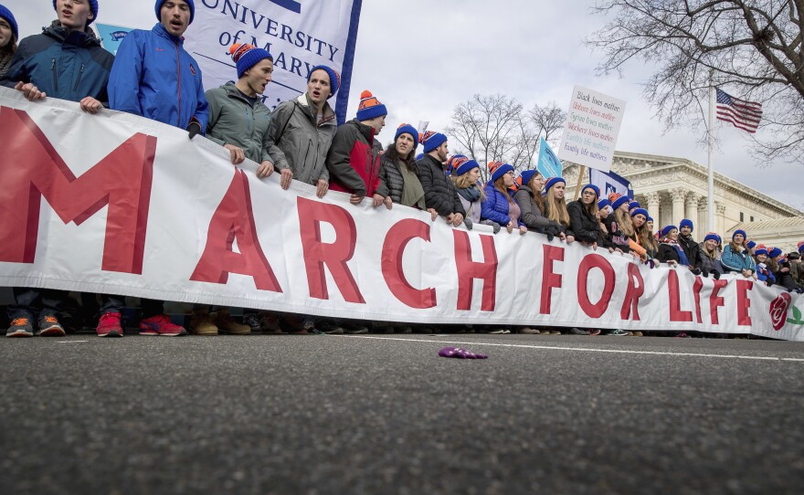 Anti-abortion activists march past the Supreme Court in Washington on Jan. 27, 2017, during the annual March for Life. President Trump is expected to address marchers this year.