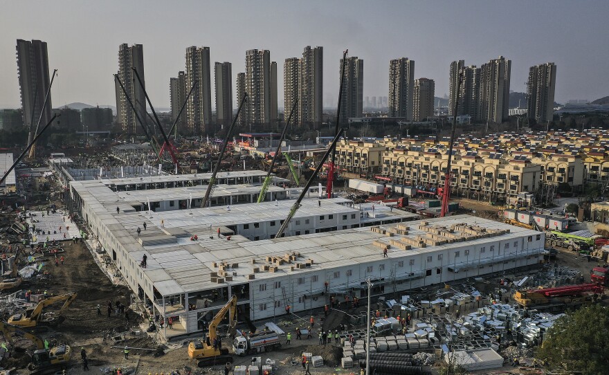 On January 23, workers started building the Huoshenshan hospital for COVID-19 patients in Wuhan, China. The photo above was taken on January 30. Construction was done on February 2, and the 1,000-bed hospital opened on February 3. Today it stands empty of patients.