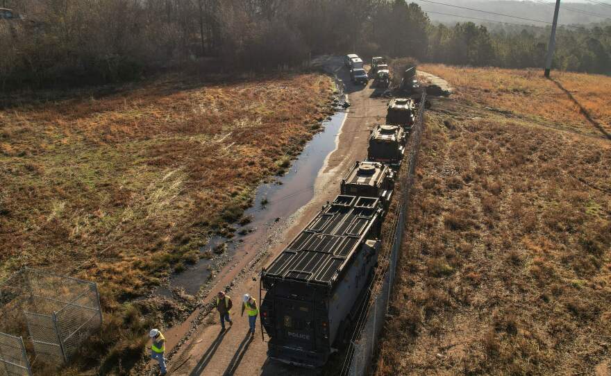 In this aerial view, law enforcement and construction crews are seen at the planned site of a police training facility near Atlanta on Feb. 6.