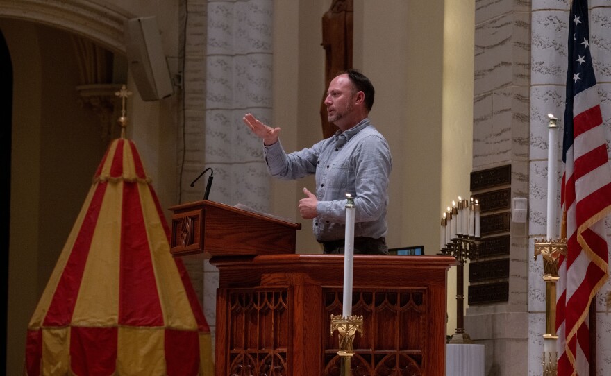 Kevin Bohlin, a member of the deaf community, delivers remarks in American Sign Language.