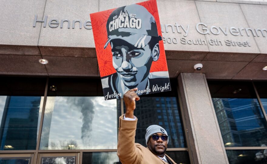 Philonise Floyd, George Floyd's brother, holding a portrait of Daunte Wright outside the Hennepin County Government Center as Potter's trial began Wednesday.