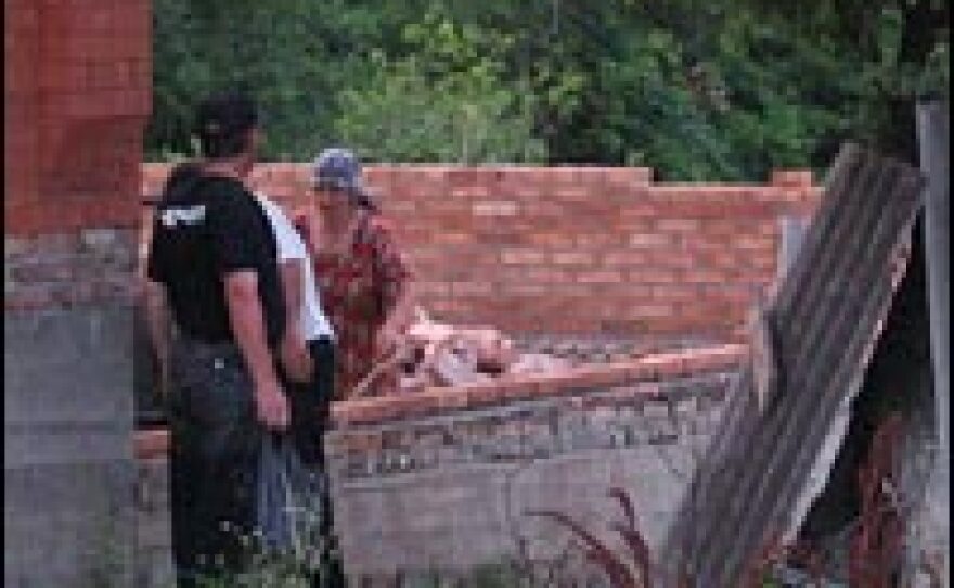 A family in the outskirts of Grozny rebuilds its house.