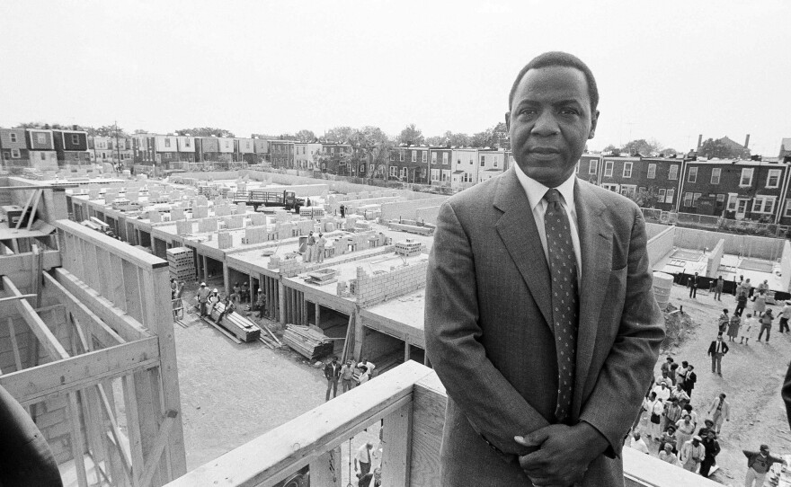 Philadelphia Mayor Wilson Goode stands on the roof of a newly constructed home, Sept. 17, 1985, on the site of the deadly battle with the group MOVE. Homeowners burned out as a result of the police siege of the MOVE headquarters watched the rebuilding process with skepticism.
