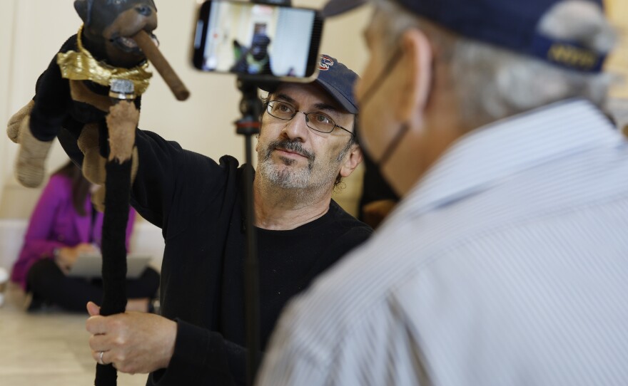 Actor and comedian Robert Smigel performs as Triumph the Insult Comic Dog in the hallways of the Cannon House Office Building on Thursday.