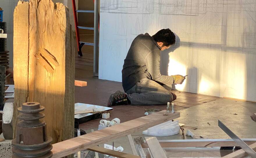 Artist Joshua Moreno is pictured at work on one of the site-specific installations on view at ICE Gallery in Logan Heights, beginning Friday, Feb. 12, 2021.