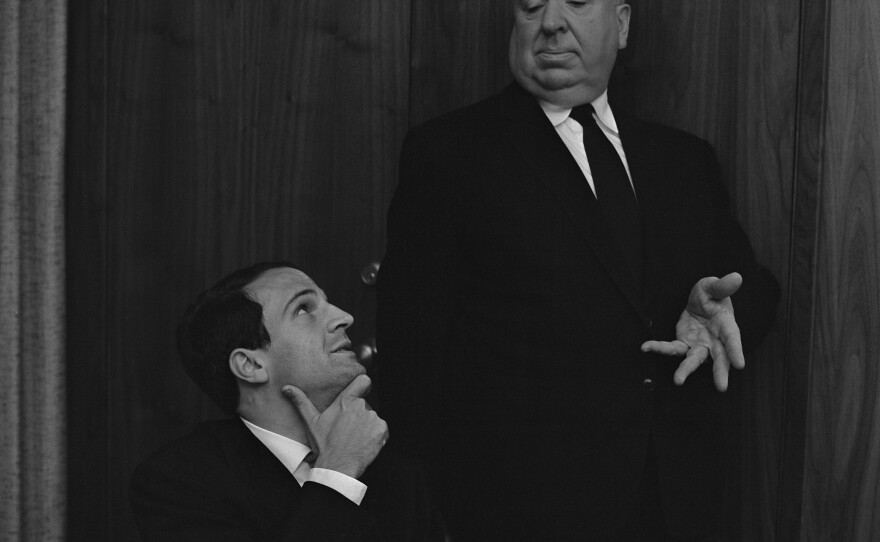 One of the famous photos from the interview between Francois Truffaut and Alfred Hitchcock. Here Hitch "directs" the French filmmaker to look up at him. The interview is now the basis of the documentary "Hitchcock/Truffaut."