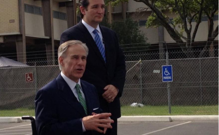 U.S. Senator Ted Cruz and Texas Attorney General Greg Abbott are seen outside of Lackland AFB after going through a tour of the facilities.