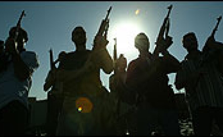 Members of a private security company pose on the rooftop of a house in Baghdad.