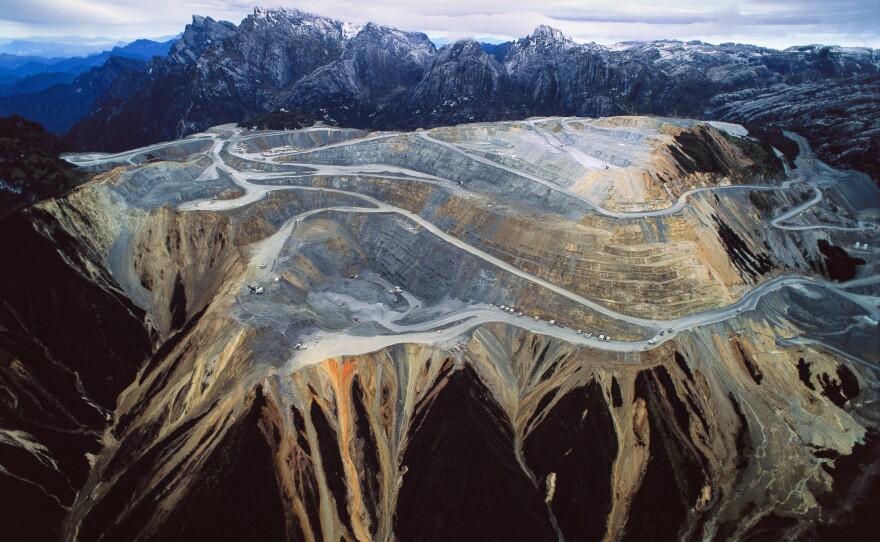 This mountain in Timika, Indonesia, was hollowed out for its gold and copper. The Grasberg mine is the world's largest gold mine — and a source of tension between the Indonesian state and citizens who blame it for flooding their lands.