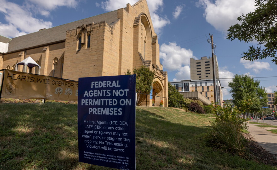 A sign reading "federal agents not permitted on premises" is seen outside the University Baptist Church in Minneapolis on Aug. 23, 2026.