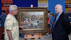 Alasdair Nichol (right) appraises a guest’s Edmund H. Osthaus watercolor, ca. 1910. 