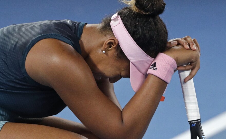 Japan's Naomi Osaka reacts to her victory over Petra Kvitova of the Czech Republic in the women's singles final at the Australian Open tennis championships in Melbourne.