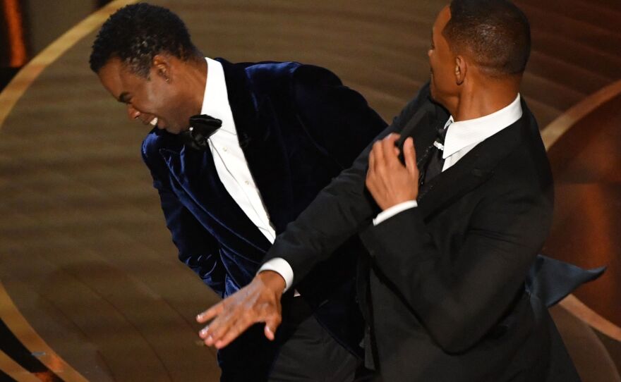 Will Smith slaps actor and comedian Chris Rock onstage during the Oscars.