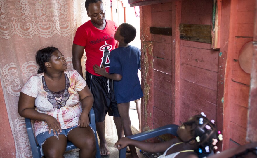 Anderson with his parents, Adrienne Jean Pierre and Roudy Desir, and sister, Rosaura Desir, in their home in San Pedro de Macoris. Under a new law, Anderson and his parents fall in one category because they were born in Haiti; his siblings fall in another category because they were born in the Dominican Republic.