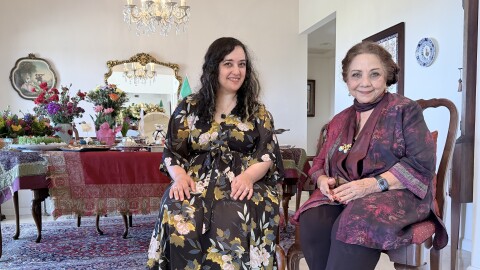 Susie Ghahremani (at left) and her mother, Zohreh Ghahremani, are shown in front of Zohreh's Nowruz spread and haft-seen on March 17, 2026. The two recently collaborated on the children's book "Celebrate Nowruz."