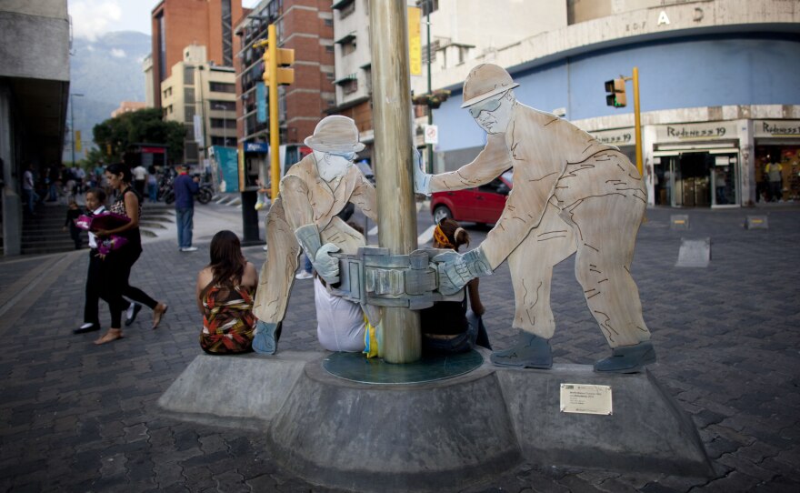 A sculpture of oil workers in Caracas, Venezuela. The country is heavily dependent on oil exports, and falling oil prices have had a ripple effect on the country's already troubled economy.
