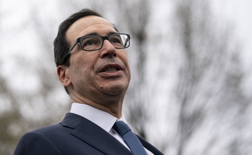 U.S. Treasury Secretary Steven Mnuchin speaks to the press outside of the West Wing of the White House on Friday.