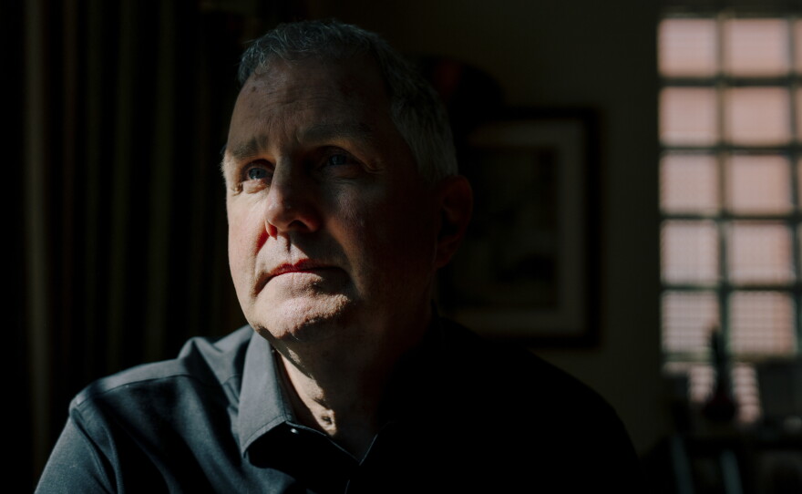Michael Rabbitt, a longtime Chicago, Ill. community organizer, sits for a portrait at his Chicago home on July 29, 2026. Rabbitt was one of six people charged with conspiracy following a 2025 protest outside an ICE facility in Broadview, Ill.