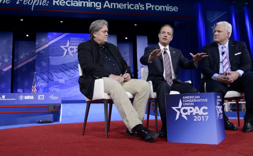 White House Chief of Staff Reince Priebus (center) speaks onstage at CPAC in National Harbor, Md., with White House adviser Steve Bannon (left) and American Conservative Union Chairman Matt Schlapp on Thursday.
