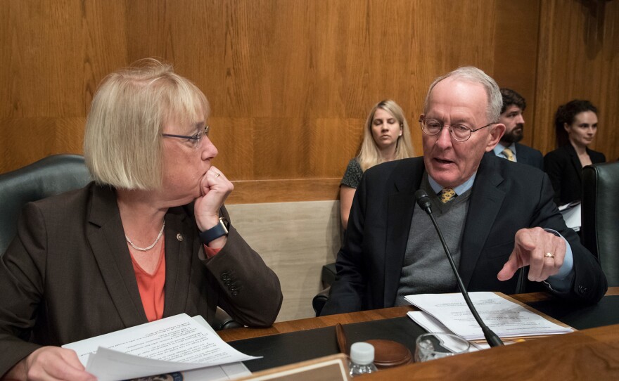 Sen. Patty Murray, D-Wash., the ranking member, and Sen. Lamar Alexander, R-Tenn., chairman of the Senate Health, Education, Labor, and Pensions Committee, meet before the start of a hearing on Capitol Hill in Washington, Wednesday, Oct. 18, 2017, the morning after they reached a deal to resume federal payments to health insurers that President Donald Trump had halted.