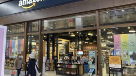 People walk by an Amazon Books store at the Westfield Garden State Plaza shopping mall in Paramus, N.J., on Jan. 10, 2022.