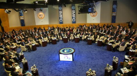 In this handout provided by the International Money Fund, International Monetary Fund's Managing Director Christine Lagarde (C) speaks at the IMFC meeting April 21, 2012 at IMF headquarters in Washington, DC. 