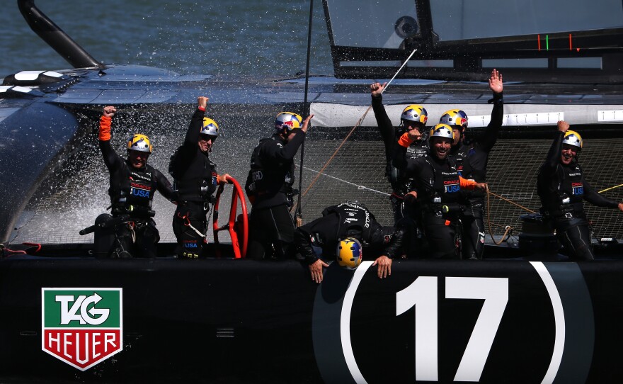 Oracle Team USA skippered by James Spithill celebrates after defending the cup as they beat Emirates Team New Zealand in the final race on Wednesday.