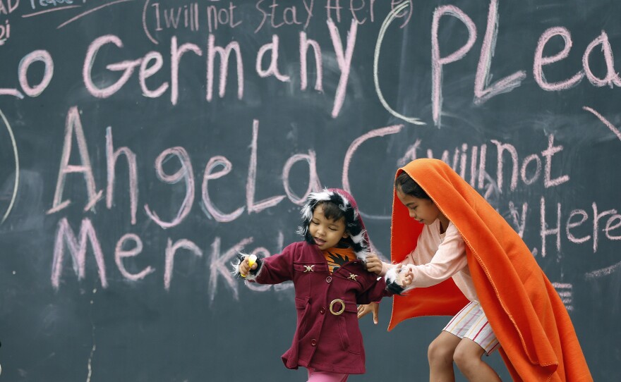 Migrant children play at Keleti railway station in Budapest, Hungary, on Friday. Many of their families hope to reach neighboring Germany in hopes of gaining political asylum.