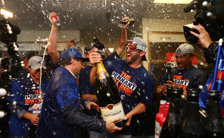 The New York Mets celebrate after sweeping the Chicago Cubs in the National League Championship Series to get to the World Series, which starts Tuesday.