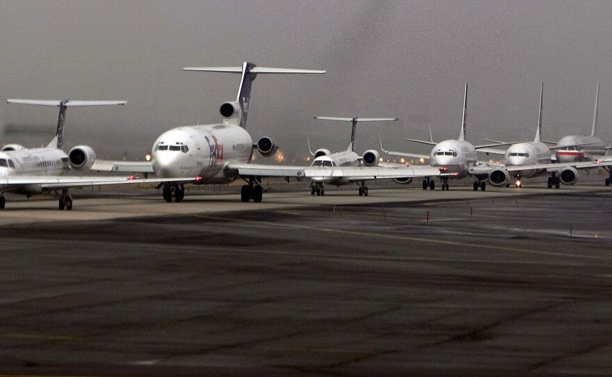 Airplanes line up as they await their turn to take off at Newark International Airport in New Jersey, February, 2008.